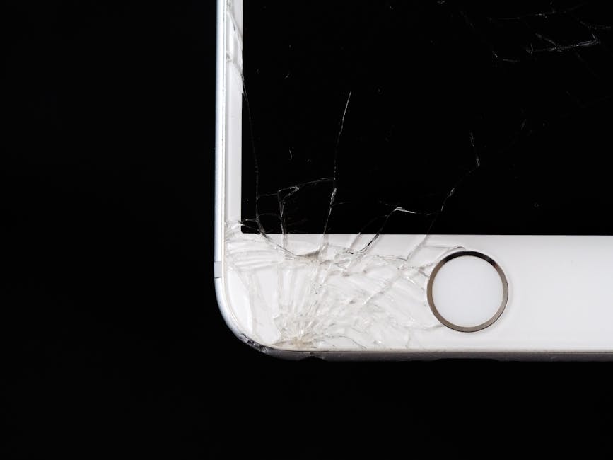 Wet smartphone sitting on a desk next to silica gel desiccant packets